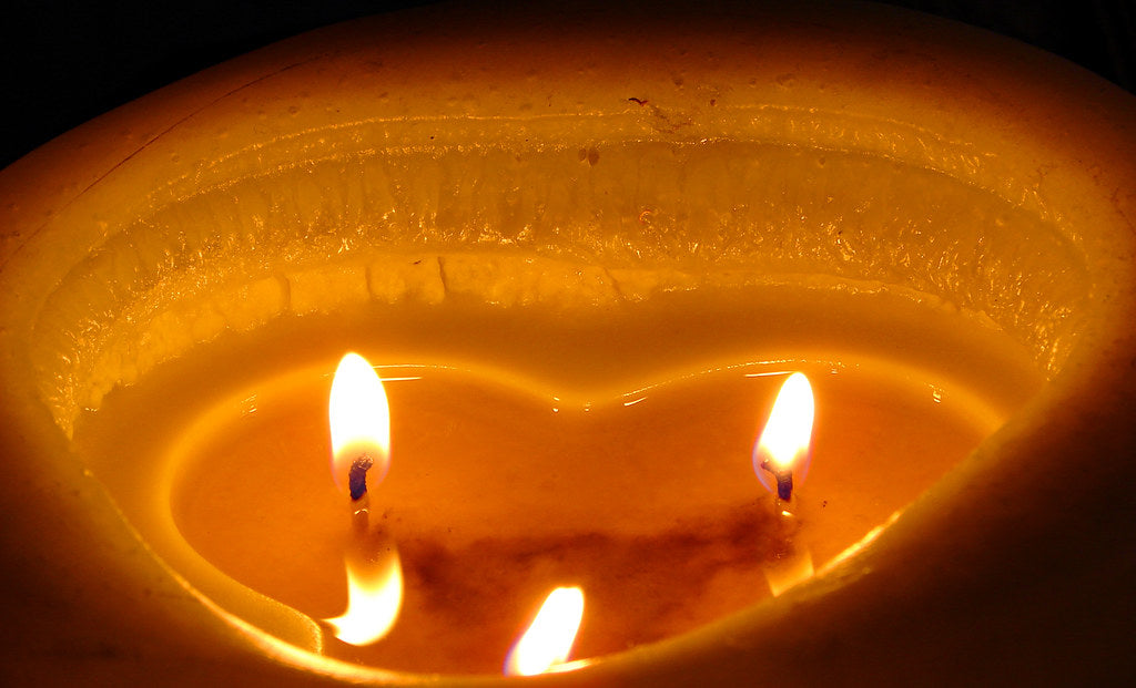 candle melted wax pool