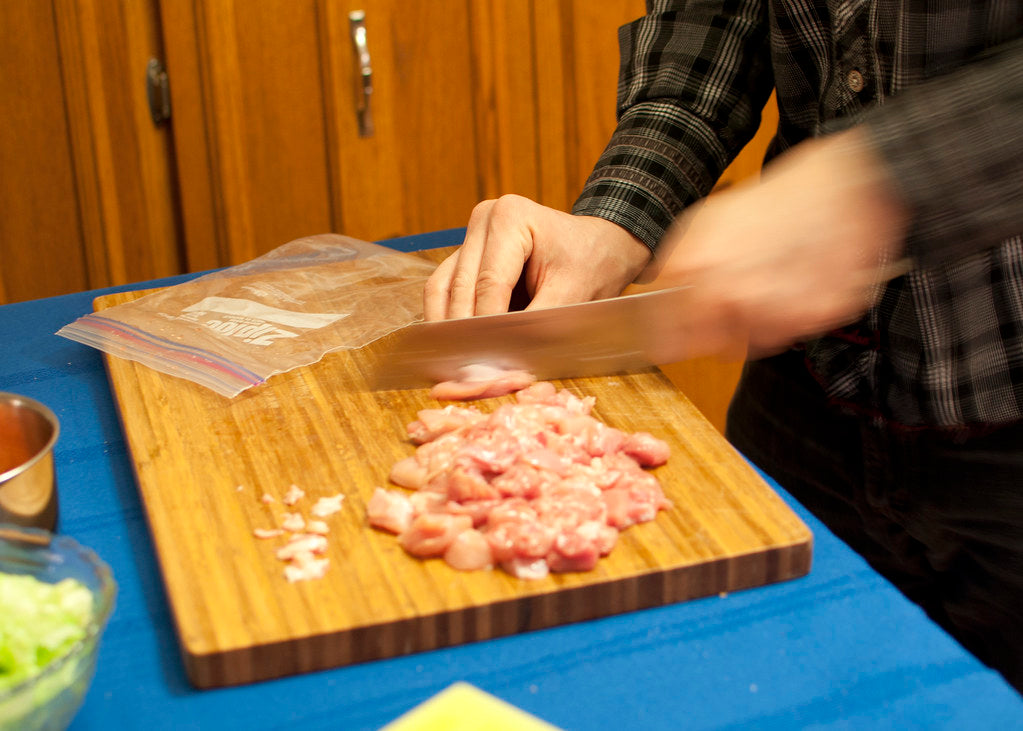 raw chicken cutting board