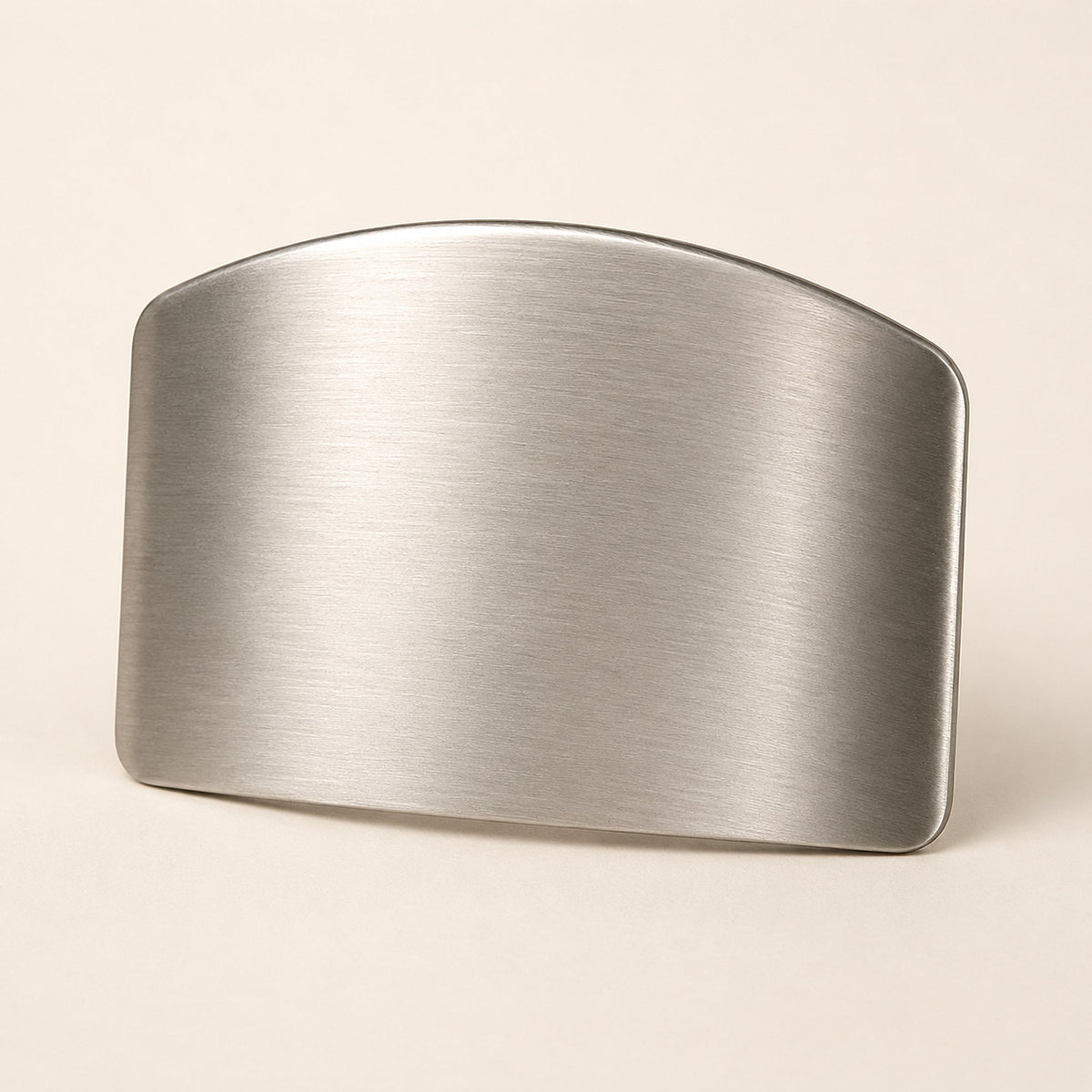 Stainless steel finger guard on a plain background, showing the brushed curved hood and rounded edge
