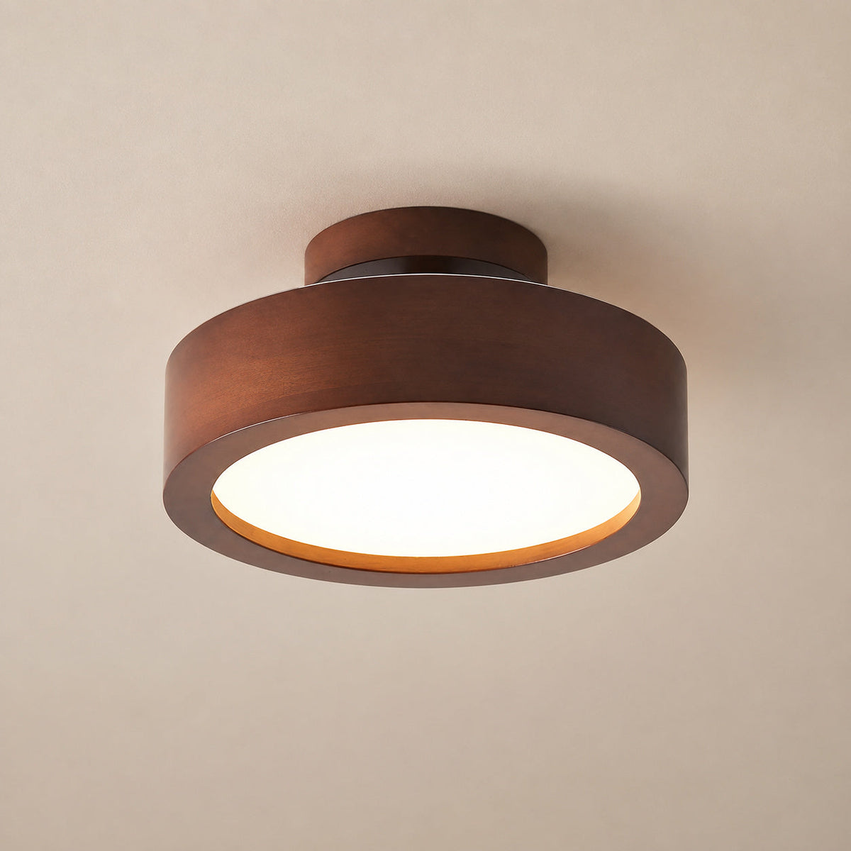 Wood flush mount ceiling light, straight-on shot on plain ceiling