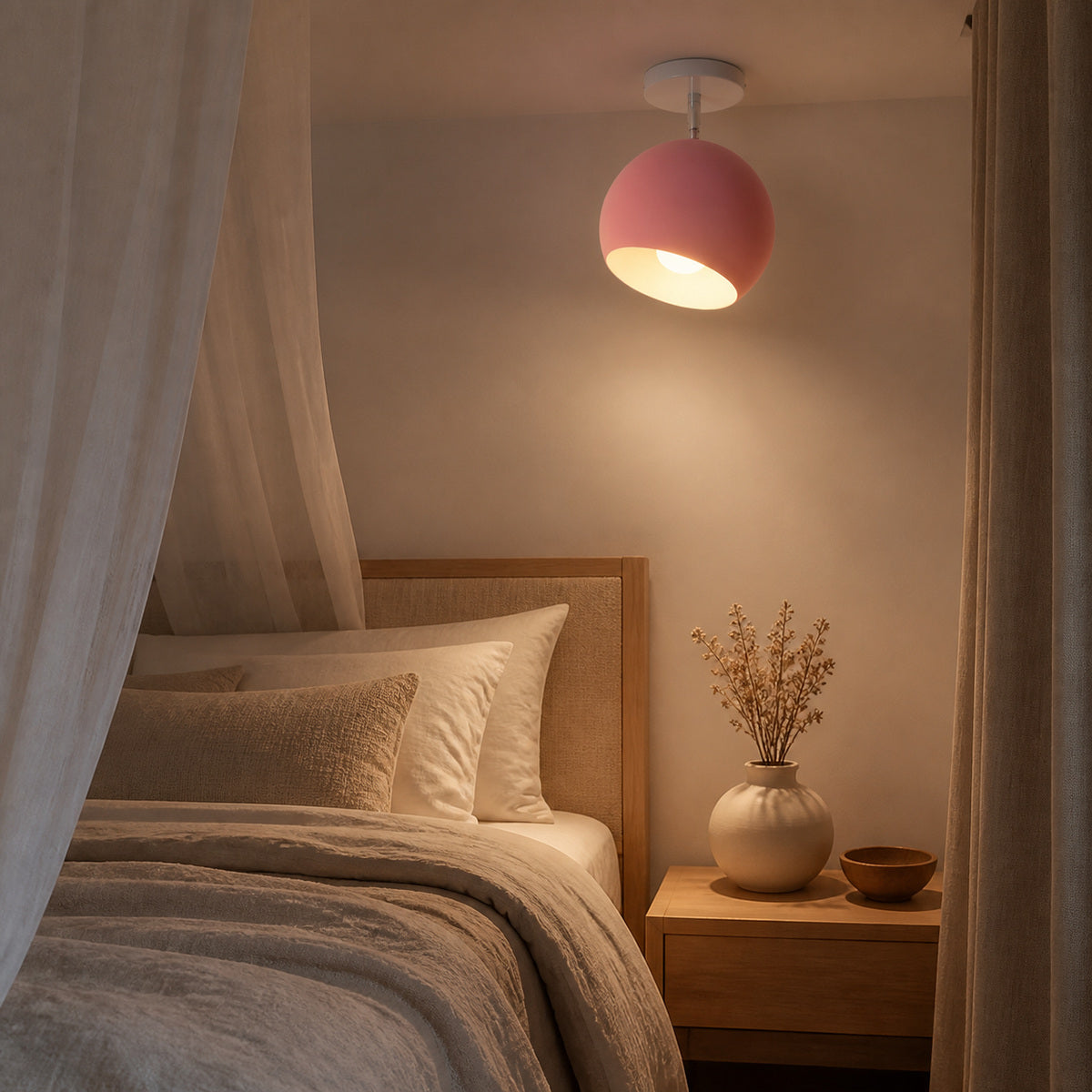 Pink modern ball ceiling light glowing in a bedroom at night