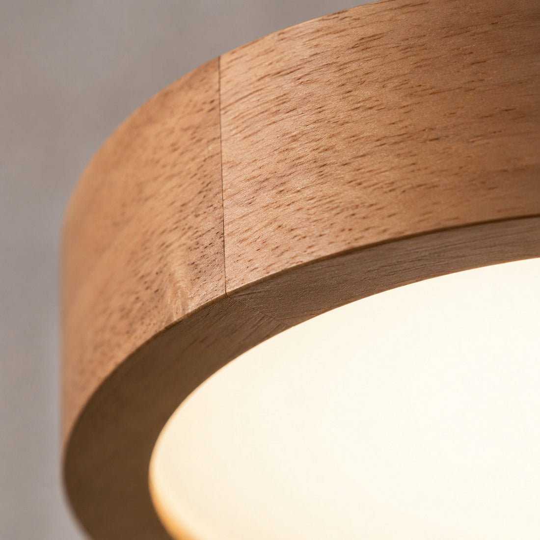 Macro detail of the wood grain and joined seam at the diffuser edge