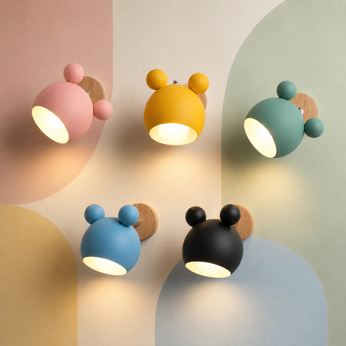 [thehouseland] best nursery wall lamp - Five lit macaron colors of the bear nursery wall sconce glowing warm on a pastel color-block wall