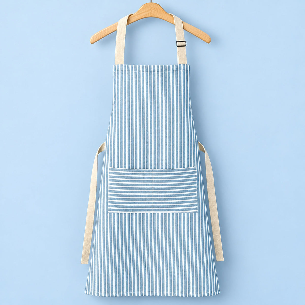 One blue striped bib apron with beige straps and divided front pocket