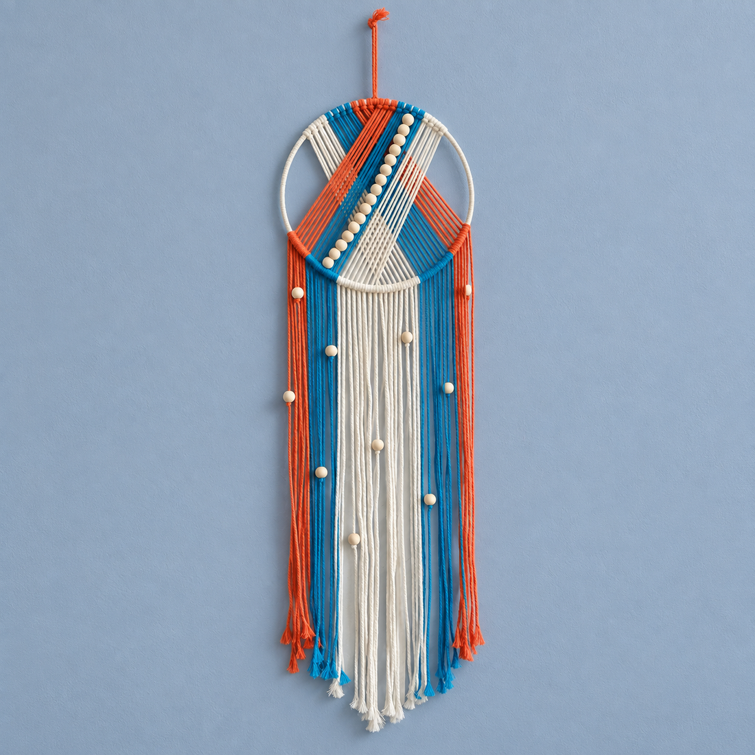 Orange and blue option studio on blue, beaded hoop with chevron and fringe