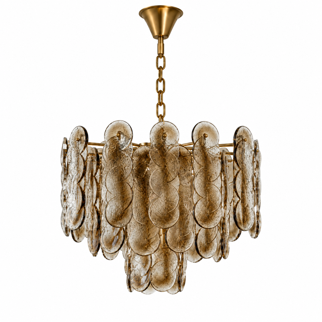 A tiered chandelier with textured, overlapping circular glass shades in a warm gold finish, suspended by a gold chain from a matching gold ceiling canopy, shown against a solid white background.