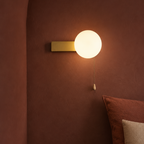 Globe Wall Sconce with Switch, Pull Chain Glass Wall Lamp, 4 Shapes 4 Colors in a bedside nook