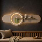 Sage oval backlit wall panel with shelf and glass bud vase, warm LED backlight on