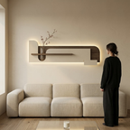 Cream backlit stone-textured wall panel shown to scale beside a person for true size reference