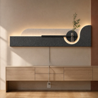 Charcoal / Arch backlit curved wall panel shown powered on with its cord routed to a wall outlet