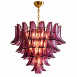 A multi-tiered chandelier featuring layered, petal-like purple glass shades with a polished gold brass canopy and chain, shown against a solid white background.