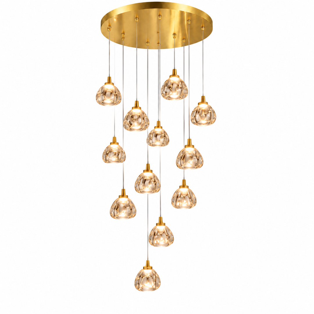 A modern multi-light chandelier with a circular gold brass ceiling canopy and ten cascading clear glass pendant shades on thin cords, shown against a plain white background.