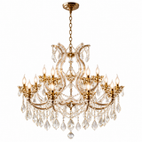 A multi-arm gold chandelier with clear crystal hanging drops and candle-style bulbs, shown against a plain white background.