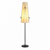 A modern floor lamp with a tapered beige fabric shade, black metal frame details, and a black stand base, shown against a plain white background.