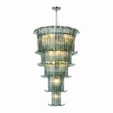 A tiered glass chandelier with a silver metal canopy and chain, featuring multiple stacked cylindrical glass shades with a textured pattern and warm light glowing from within, shown against a plain white background.