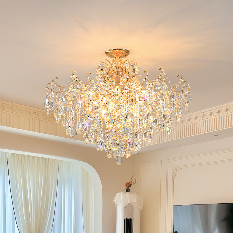 Chandelier hanging in a room with curtains and decor