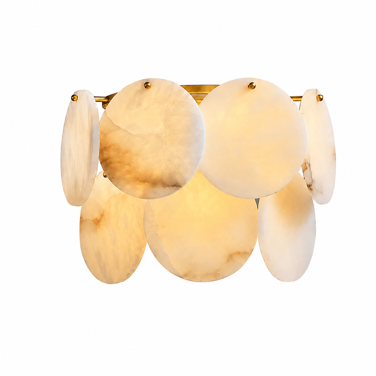Wall sconce with overlapping cream alabaster discs and brass fittings, glowing warmly against a white background.