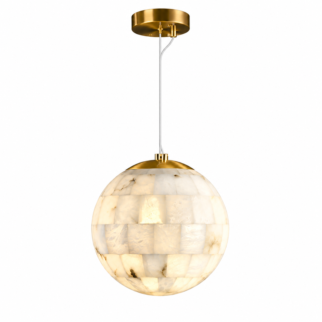 A modern spherical pendant light featuring a warm white and cream marbled shell or stone mosaic globe, suspended by a white cord from a polished gold-finished ceiling canopy.