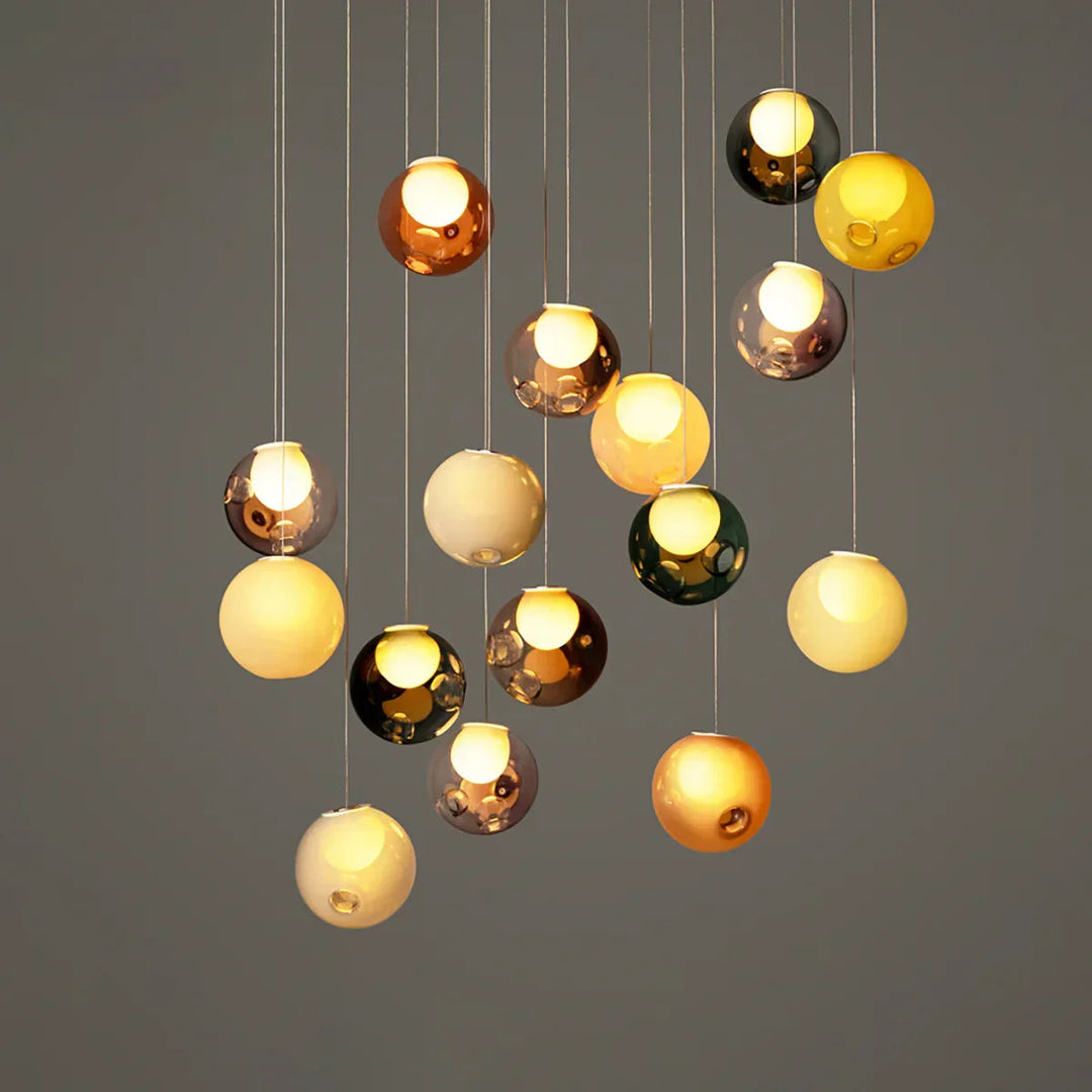 Chandelier with multicolored glass balls on a gray background