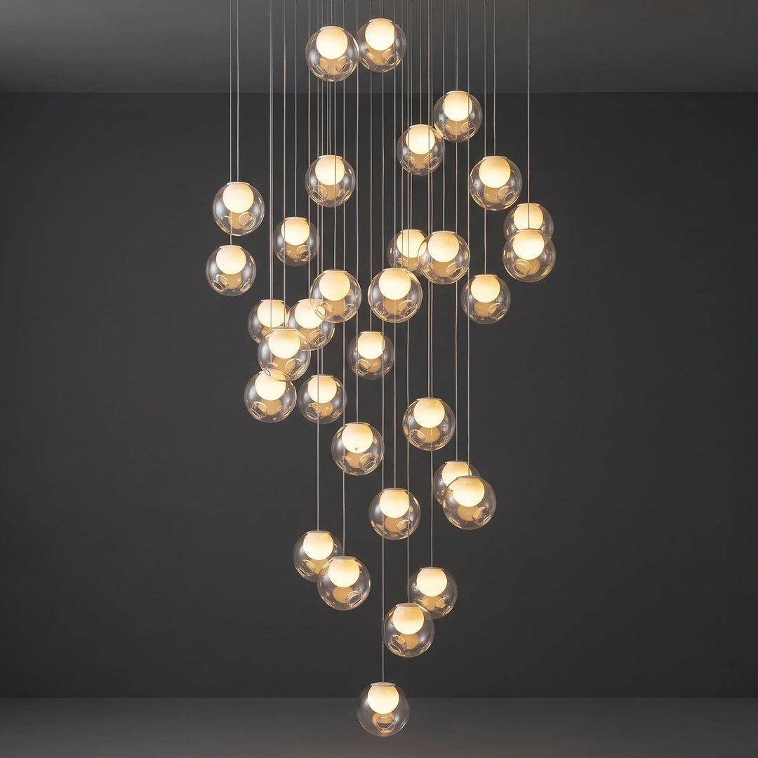 Modern chandelier with multiple spherical bulbs on a dark background
