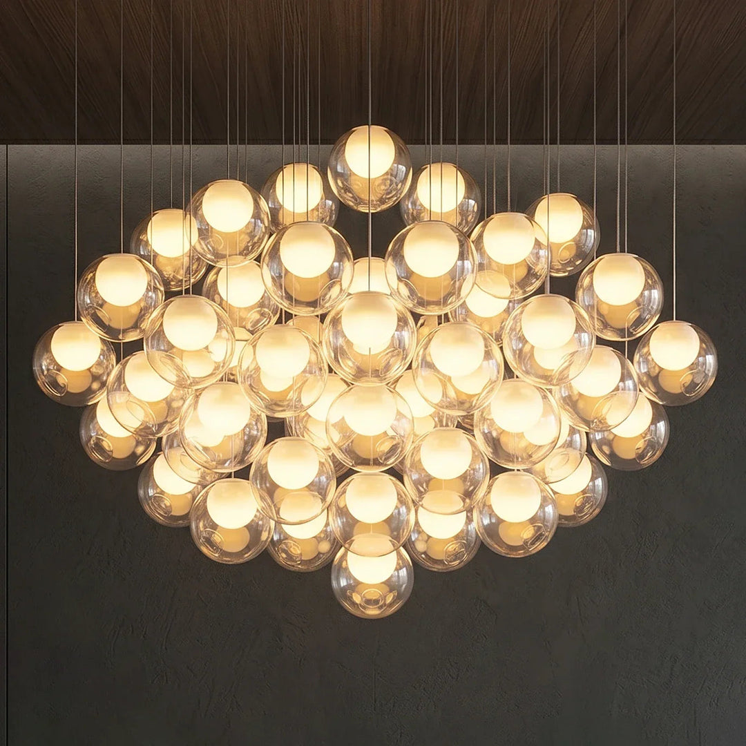Chandelier with multiple illuminated bulbs on a dark background