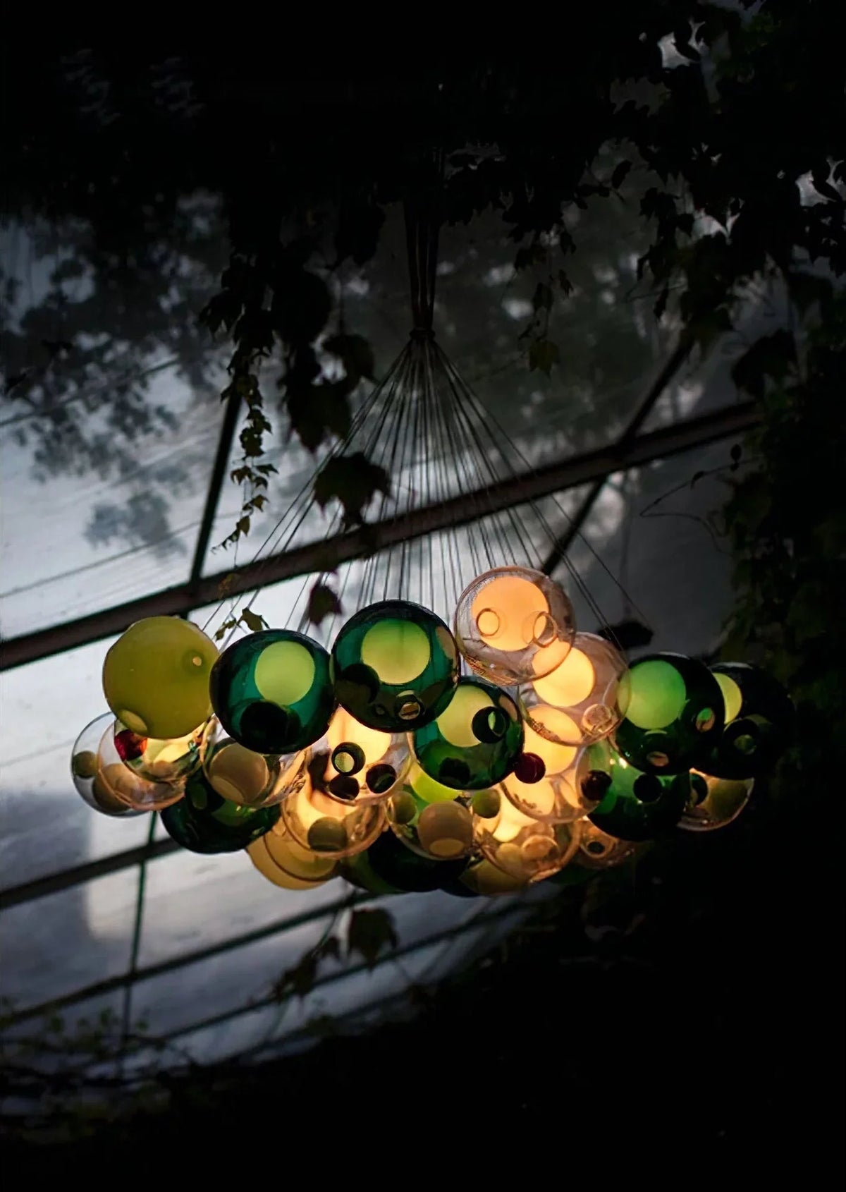 Chandelier made of glass bottles with a dark background