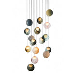 Chandelier with multicolored glass globes suspended at staggered heights against a white background.