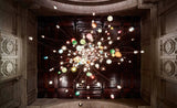 Colorful chandelier hanging in a grand room with wooden paneling