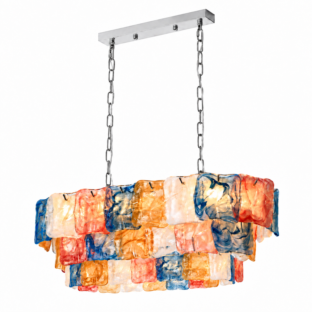 Linear chandelier with tiered pink, blue, amber and white textured glass panels, silver-toned chains and a matching canopy against a white background.