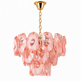 A modern multi-light chandelier featuring organic, wavy pink glass shades suspended from a gold-toned metal frame, chain, and ceiling canopy, shown against a plain white background.