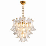 A modern multi-tier chandelier with clear textured glass petal-like shades and a polished gold brass chain and canopy, shown against a solid white background.