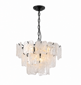 A modern multi-light pendant chandelier featuring textured, irregular clear glass or acrylic blocks suspended by black metal chains and brackets, shown against a plain white background.