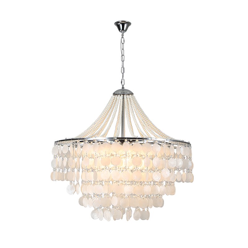 Tiered chandelier with cream oval discs, draped bead strands, and a silver-toned frame and hanging chain against a white background.