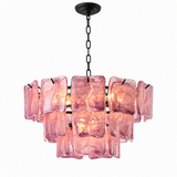 A modern chandelier featuring multiple rectangular pink glass panels suspended from a black metal frame, chain, and ceiling canopy, shown against a plain white background.