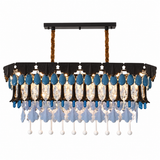 A rectangular chandelier with a black metal frame, brown rope suspension, clear glass panels, blue teardrop accents, and cascading blue and white crystal drops, shown on a plain white background.