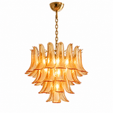 A multi-tiered chandelier featuring curved amber-tinted glass shades suspended from a gold-finished chain and ceiling canopy, shown against a plain white background.