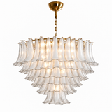 A modern multi-tiered chandelier with clear textured glass bell-shaped shades and a brushed gold metal frame, canopy, and chain, shown against a plain white background.