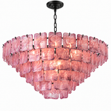 A modern tiered chandelier featuring textured, translucent pink glass rectangular shades suspended from a black metal frame and chain.