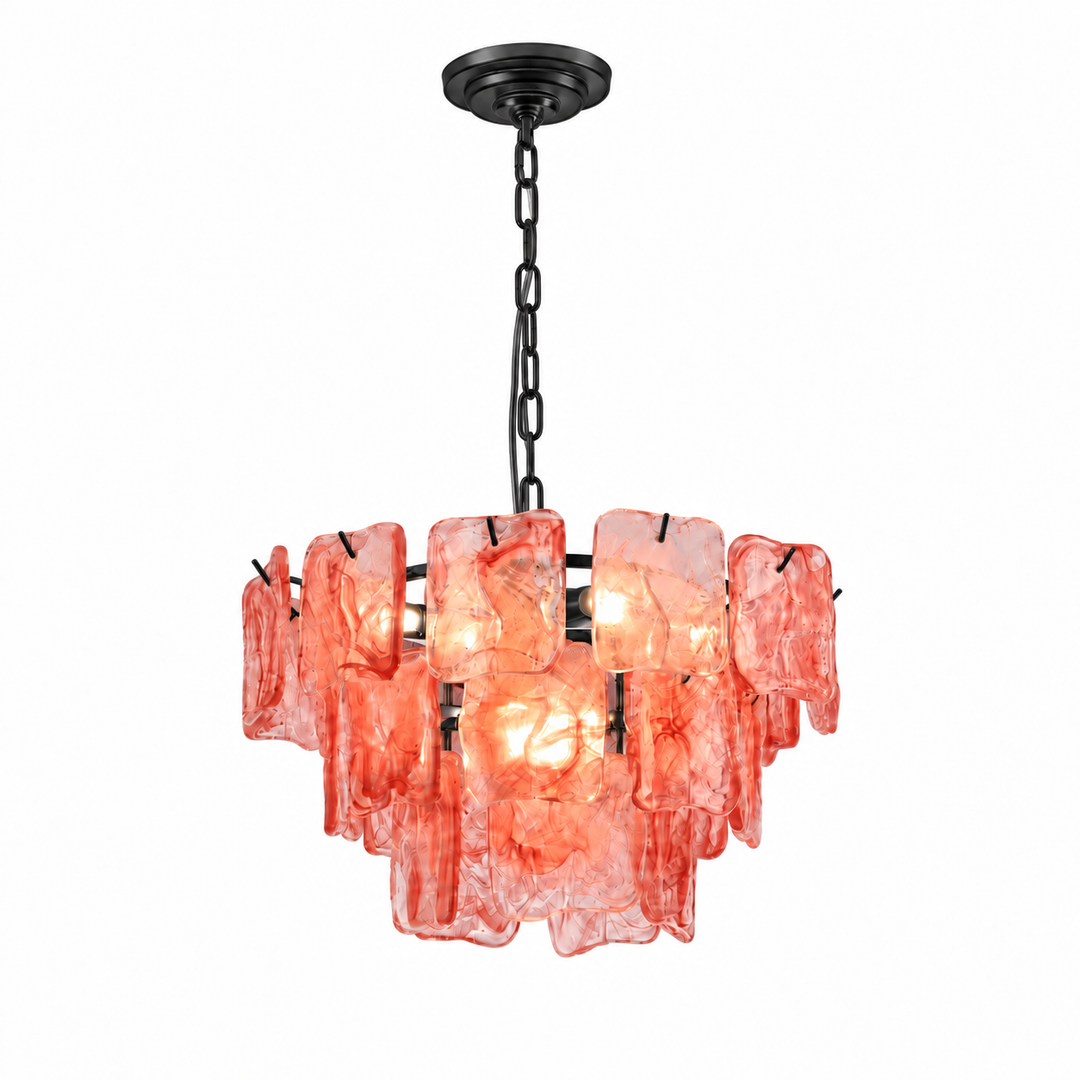 A modern multi-light pendant chandelier featuring textured, translucent coral-pink glass shades suspended from a black metal frame and chain.