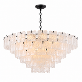 A modern multi-tier chandelier with textured, irregularly shaped clear glass shades suspended from a black metal frame and chain, shown against a plain white background.