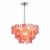 A modern multi-light pendant chandelier featuring textured, irregularly shaped coral-pink glass shades suspended from a polished silver-tone metal chain and canopy, shown against a solid white background.
