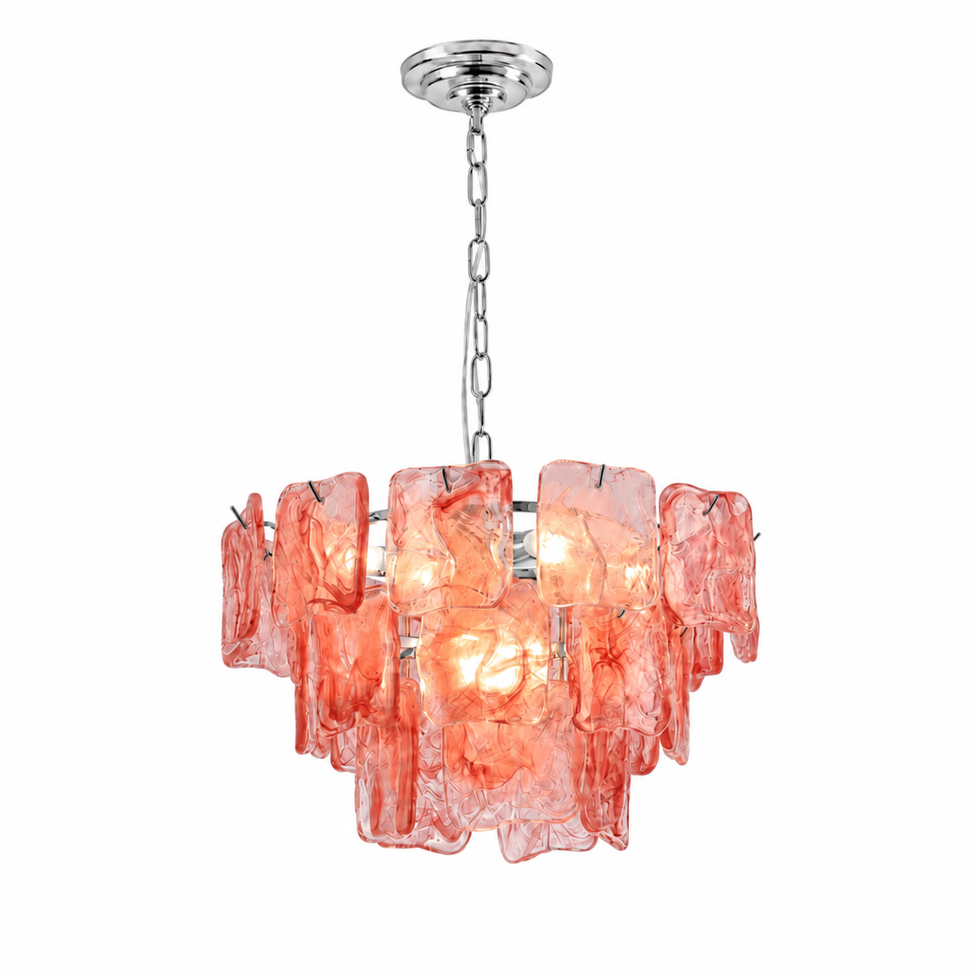 A modern multi-light pendant chandelier featuring textured, irregularly shaped coral-pink glass shades suspended from a polished silver-tone metal chain and canopy, shown against a solid white background.