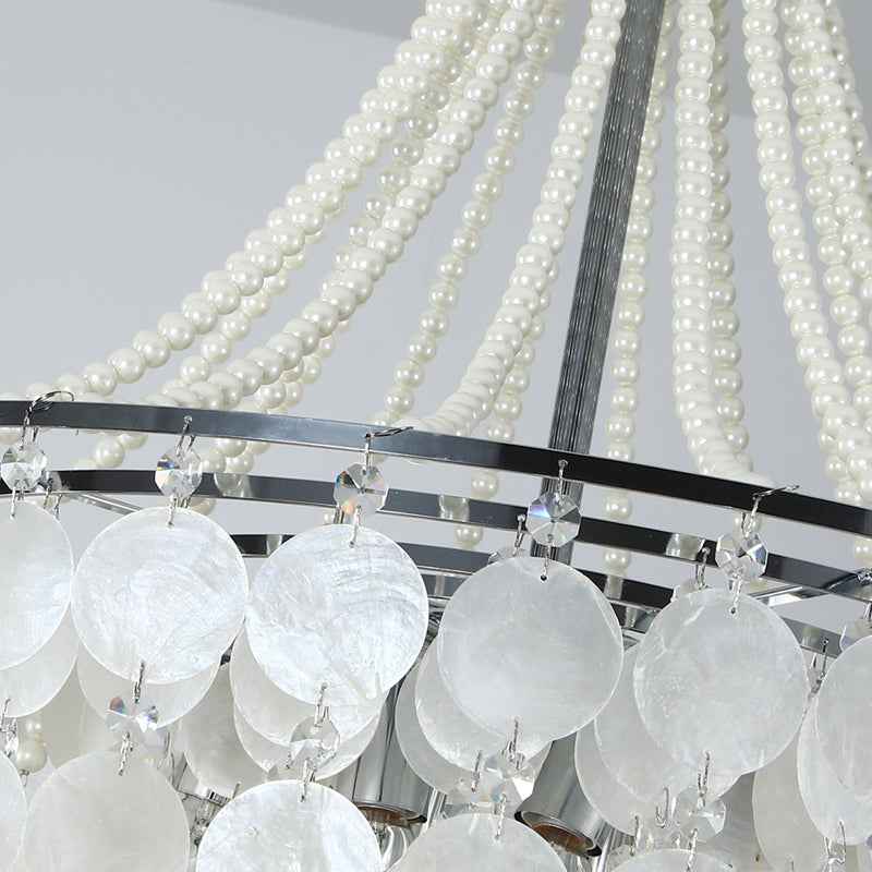 Chandelier with white glass shades and pearl-like beads