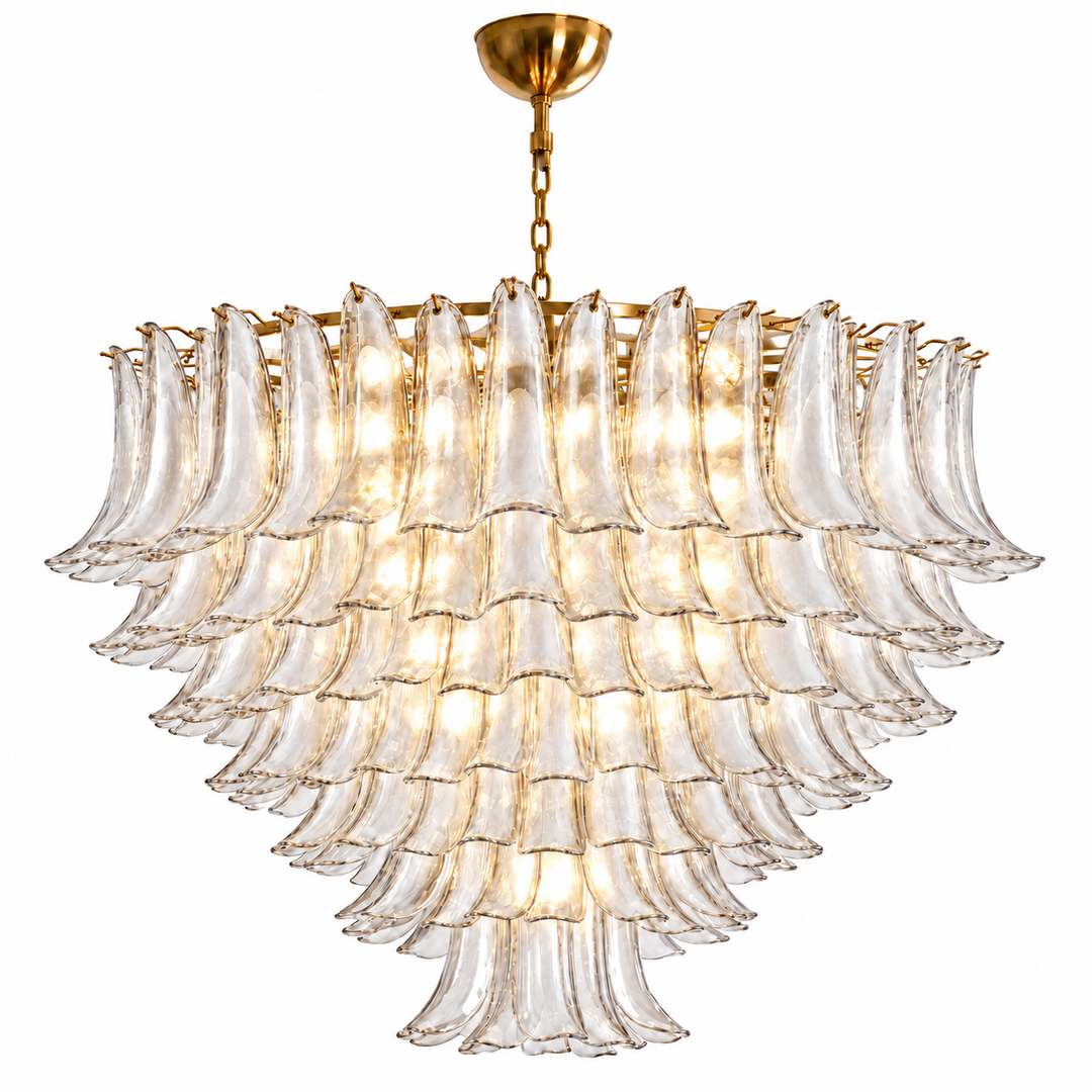 A modern tiered chandelier with clear ribbed glass fluted shades and a brushed gold metal frame, canopy, and chain, shown against a solid white background.