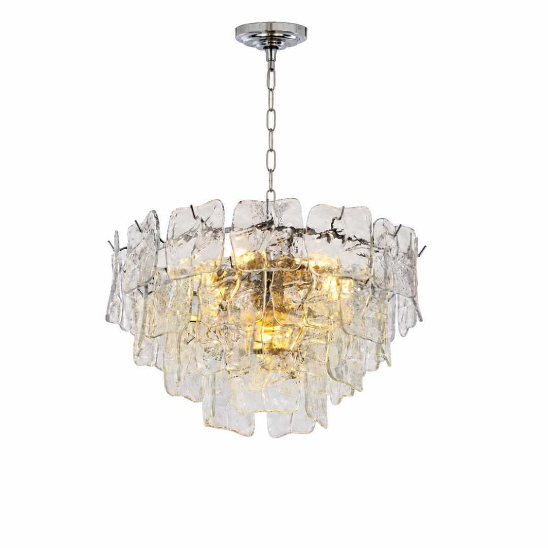 A modern multi-light chandelier featuring a circular arrangement of clear, textured glass pieces suspended from a polished silver-toned metal frame and chain.