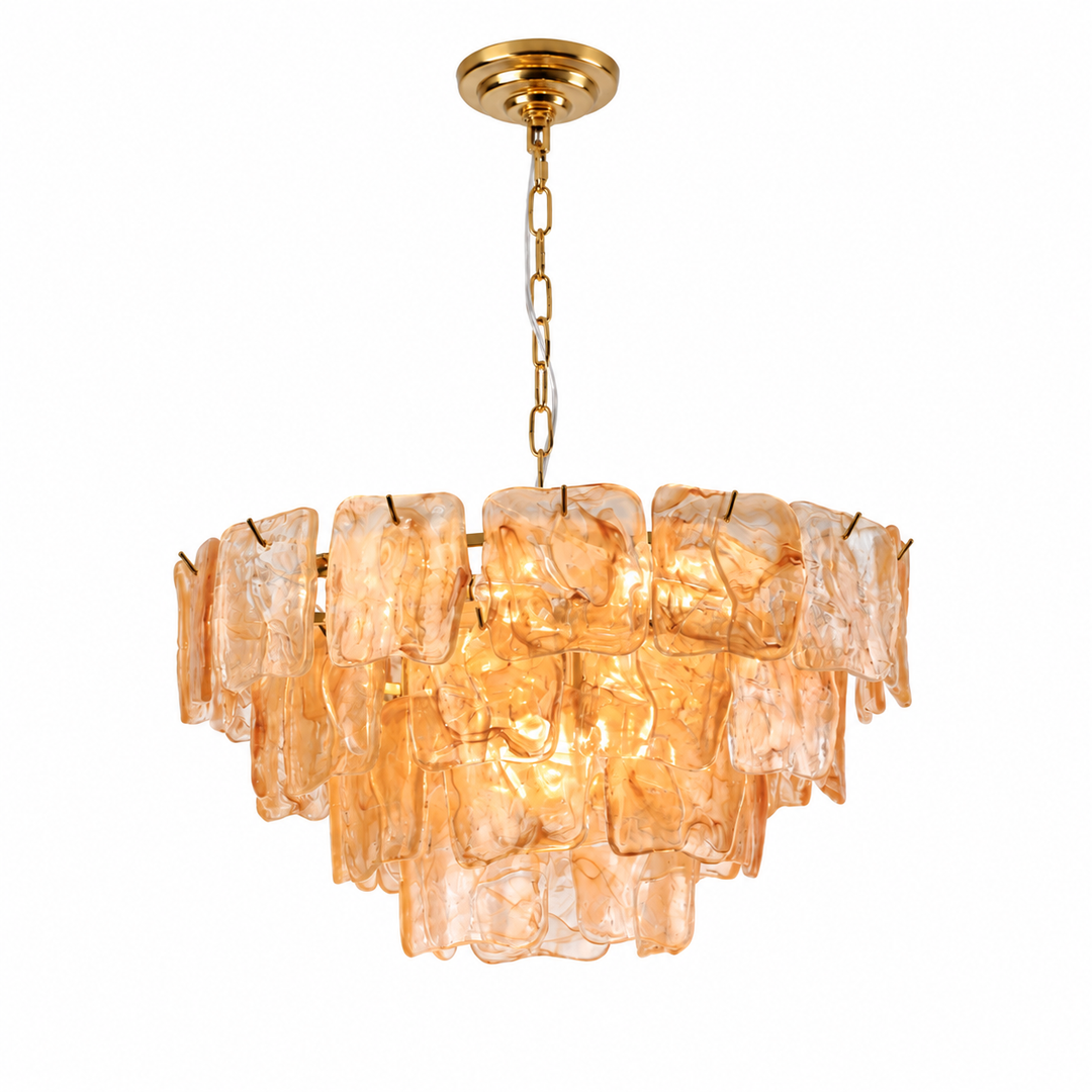 A modern chandelier featuring a tiered arrangement of translucent amber-orange glass plates suspended from a polished gold-toned brass frame and chain.