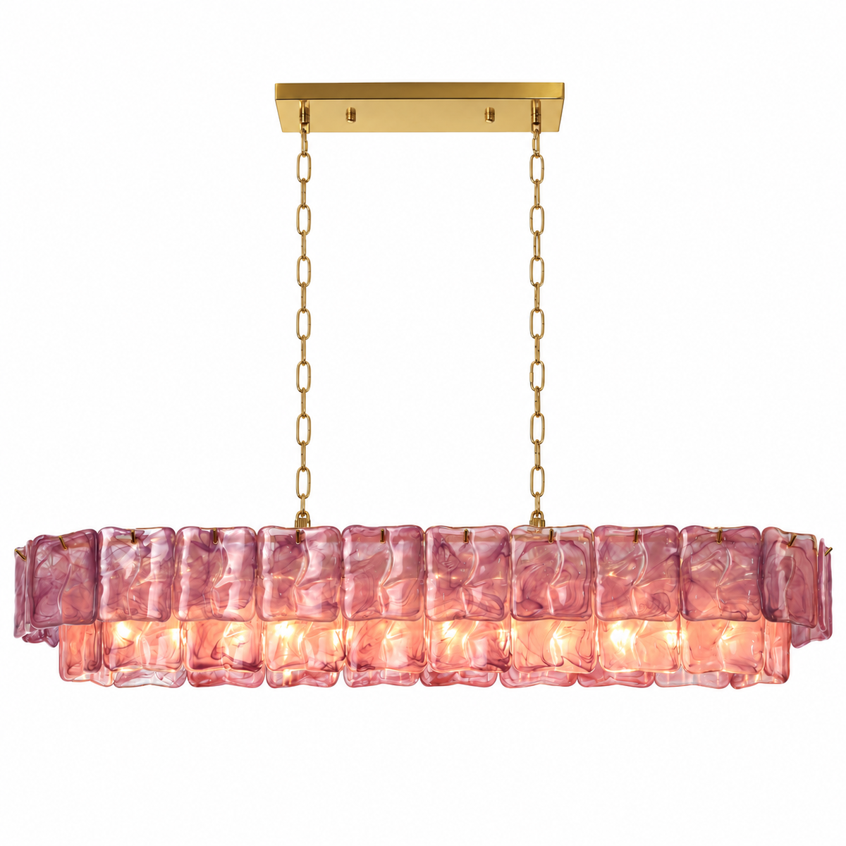 A modern linear chandelier with a warm gold ceiling canopy and chains, featuring a horizontal row of textured, wavy pink glass rectangular shades that glow with warm light, shown against a solid white background.