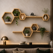Hexagonal wooden floating wall shelves styled in a modern living room setting, holding various potted green plants, ceramic vases, books, and a lit candle against a textured beige wall.