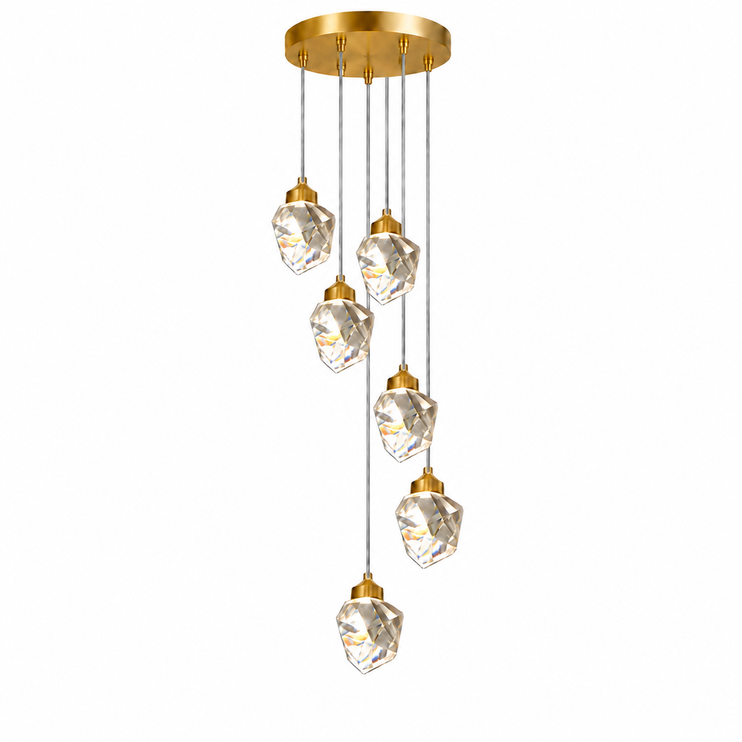 A modern multi-light linear chandelier with a brushed gold circular ceiling canopy, slim gold-finished suspension rods, and five faceted clear crystal pendant globes of decreasing size, shown against a solid white background.