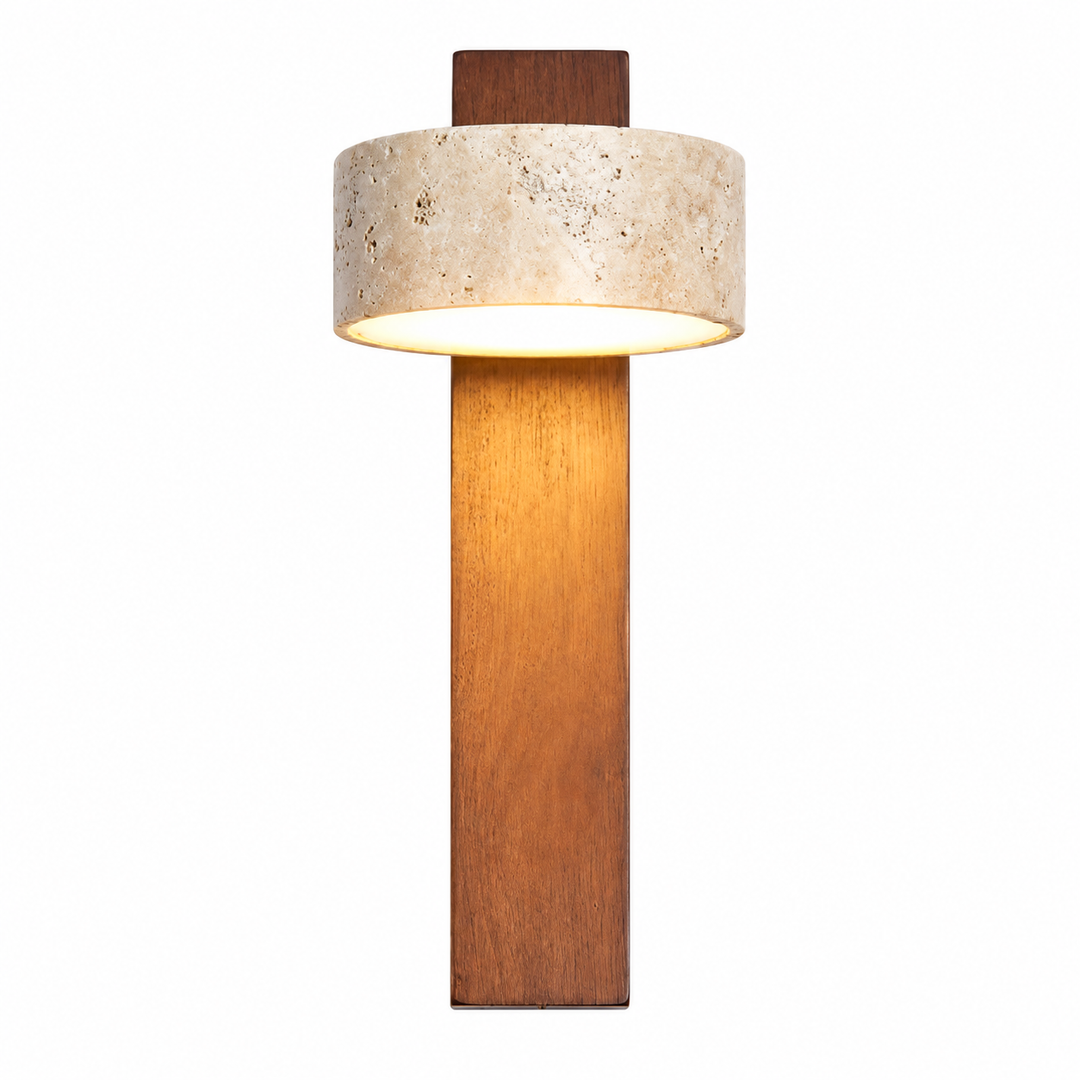 A modern wall sconce featuring a tall, rectangular warm brown wood base, a cylindrical textured beige stone shade, and a dark brown wood mounting plate, shown illuminated against a solid white background.